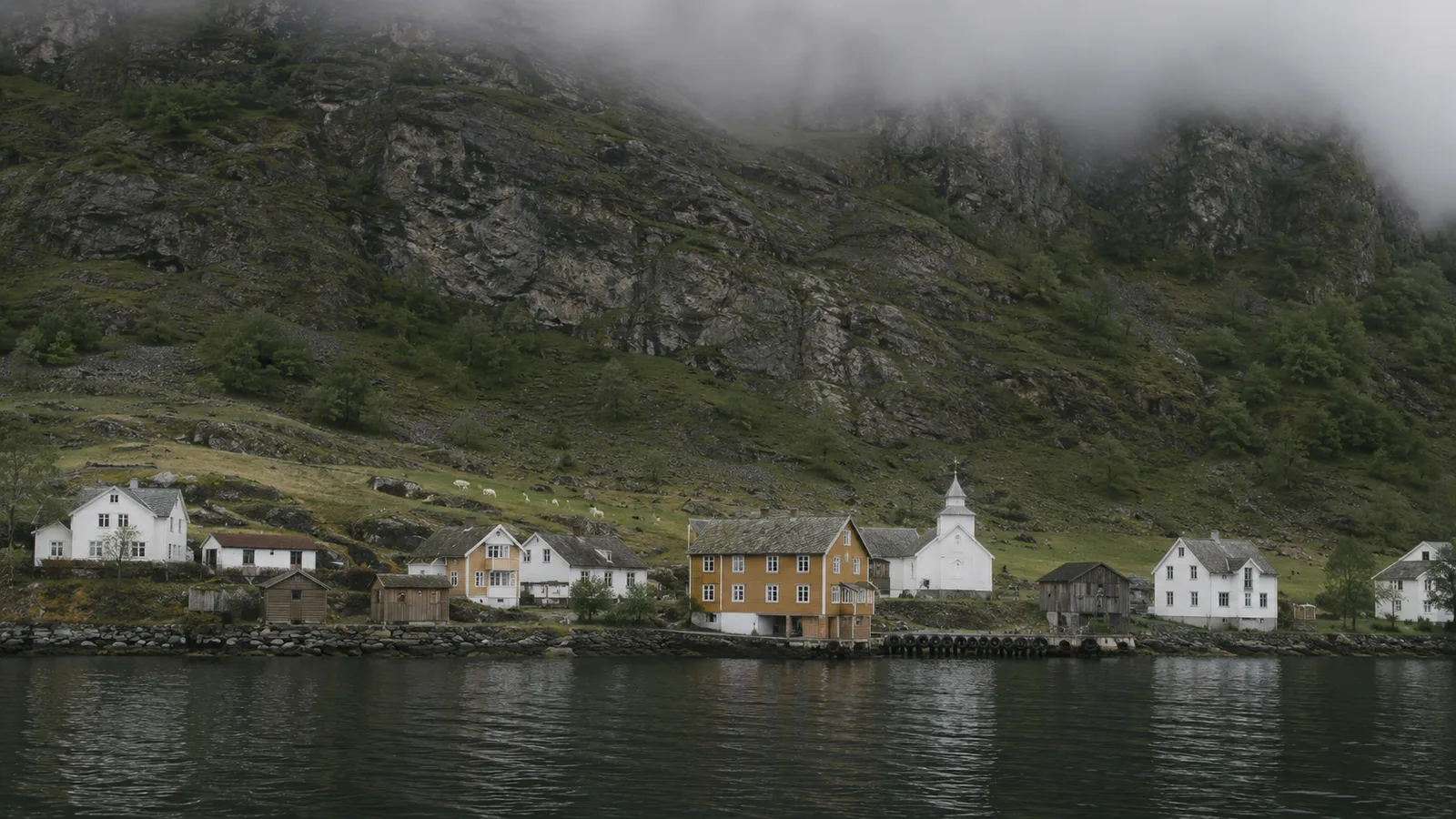 The village of Undredal with the fjord and mountains behind it